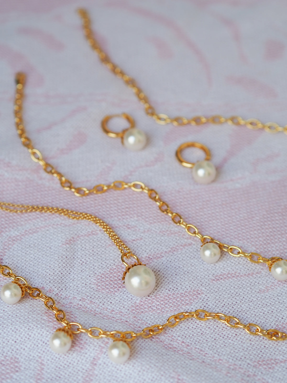 Single Palm Pearl Necklace, Earrings, and Bracelet