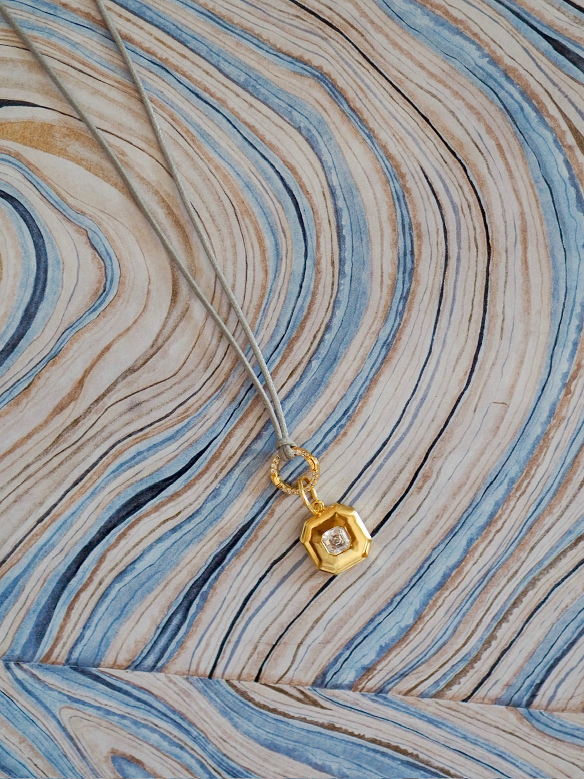 cut corner charm on taupe cord